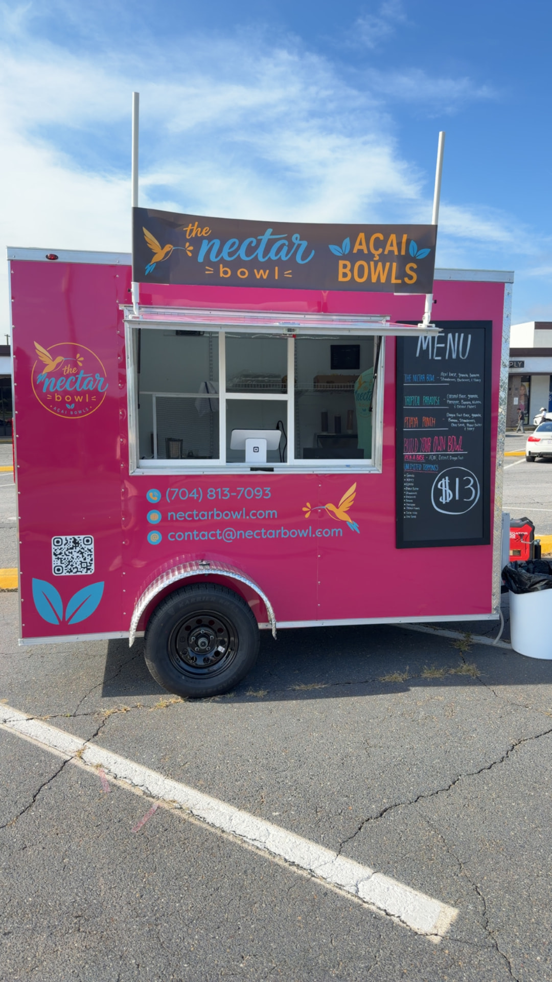 The Nectar Bowl pink açaí trailer parked in Kings Mountain, NC with its menu board showing $13 bowls